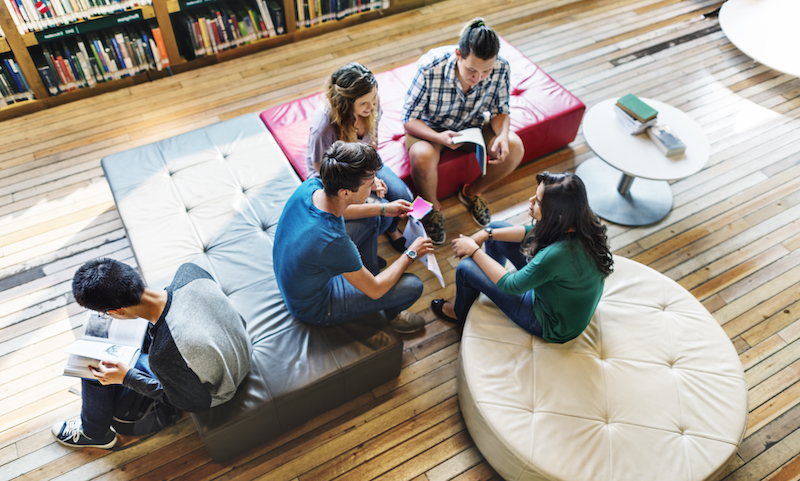 international college students studying in library