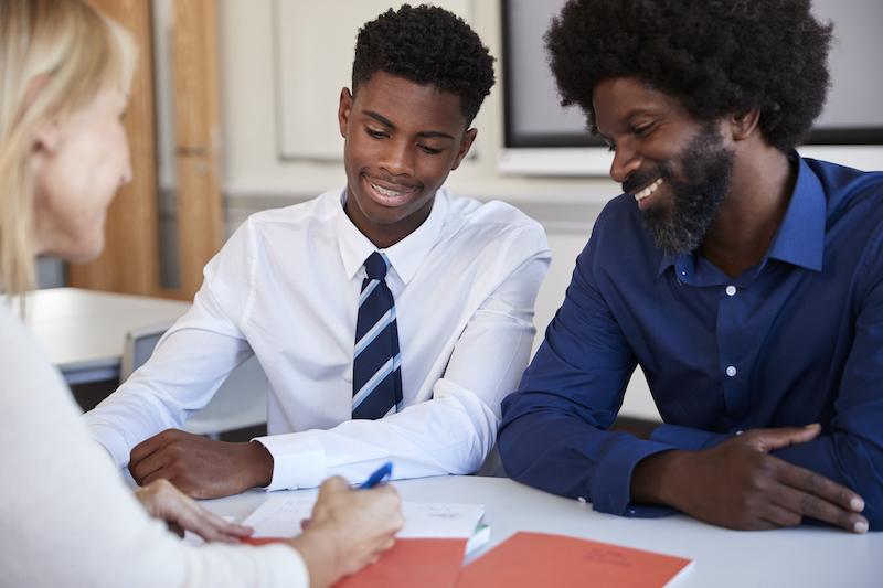 father helping student with the college application process