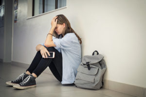 high school student experiencing test anxiety before exam