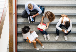 Group of students on stairs in high school.