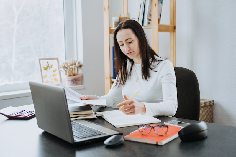 Remote accountant working on their laptop in a home office