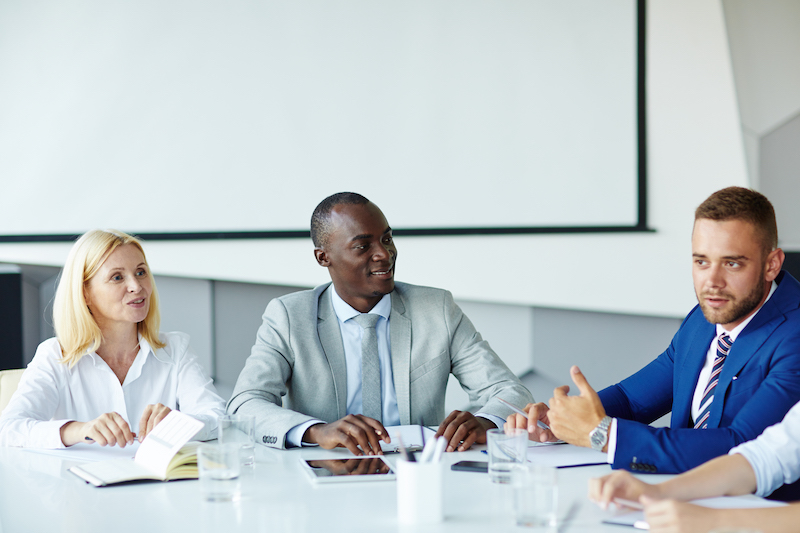 Business colleagues brainstorming at a conference table