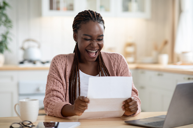 Excited student receives early decision college acceptance letter