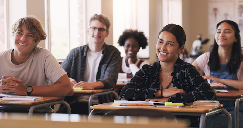 Shot of a group of teenagers in a classroom at a high school