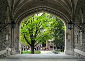 Princeton University campus building with trees in the background