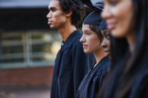 A group of college graduates lined up at graduation