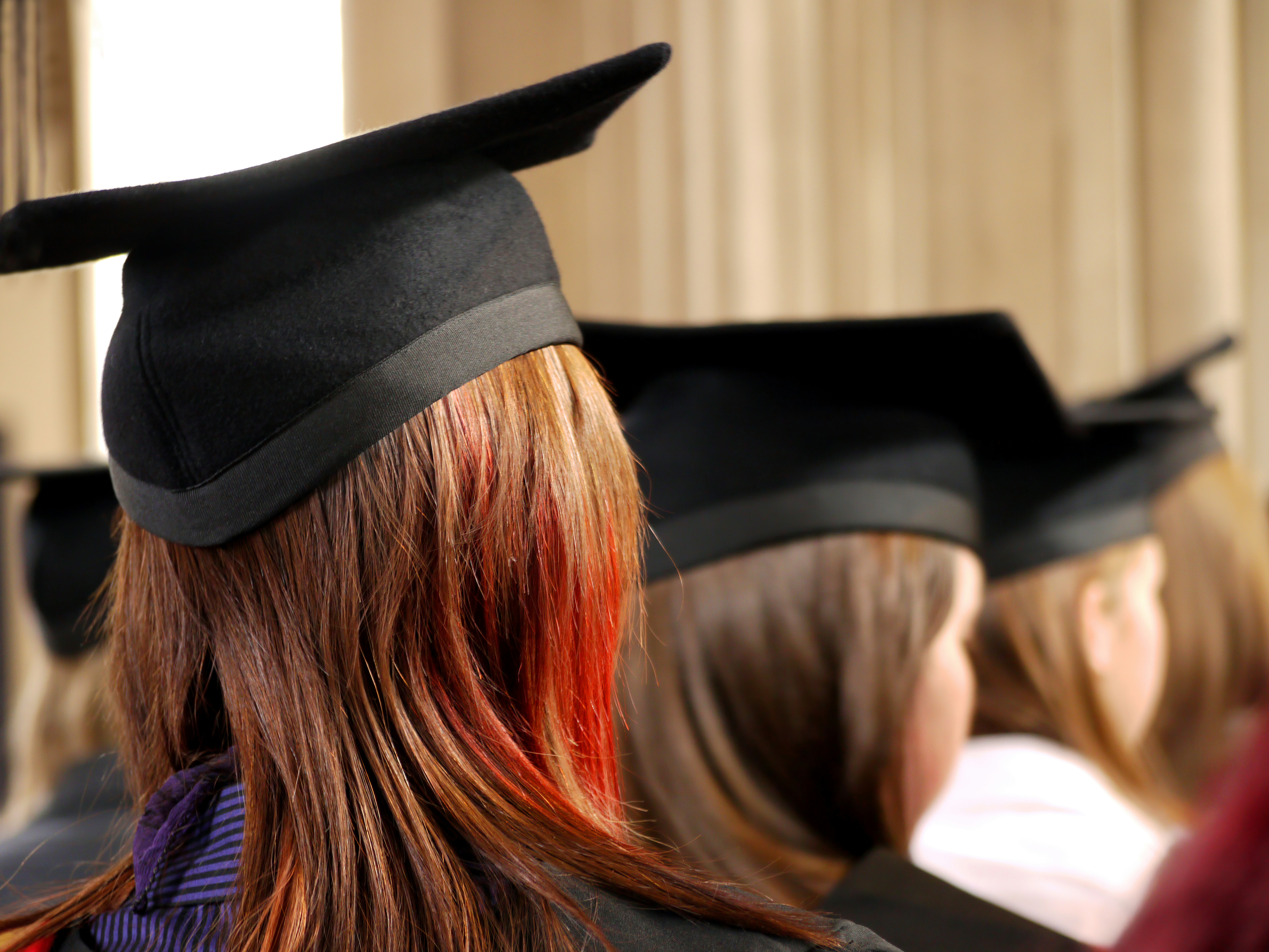 college graduation with students sitting