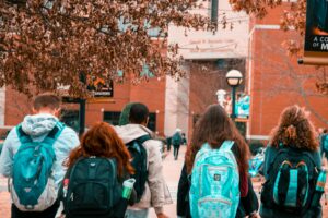 high school students walking into school