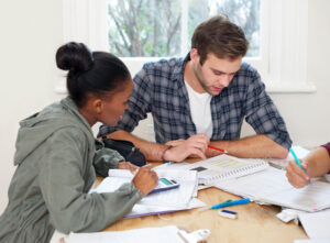 A girl and a guy studying and preparing for an exam