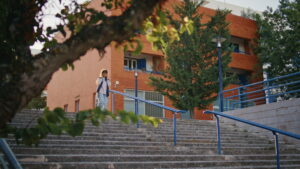 Girl walking down stairs at a highschool in Las Vegas.