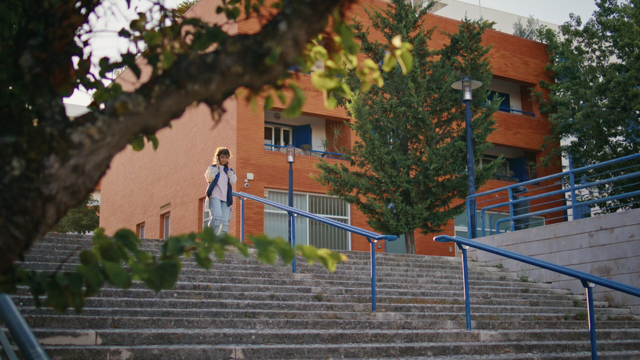 Girl walking down stairs at a highschool in Las Vegas.