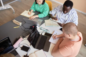 Group of students studying and making notes for the MCAT