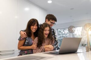 Student gets accepted into a college with parents in the back