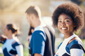 Happy, sports and portrait of a black woman at cheerleading, rehearsal and team practice.
