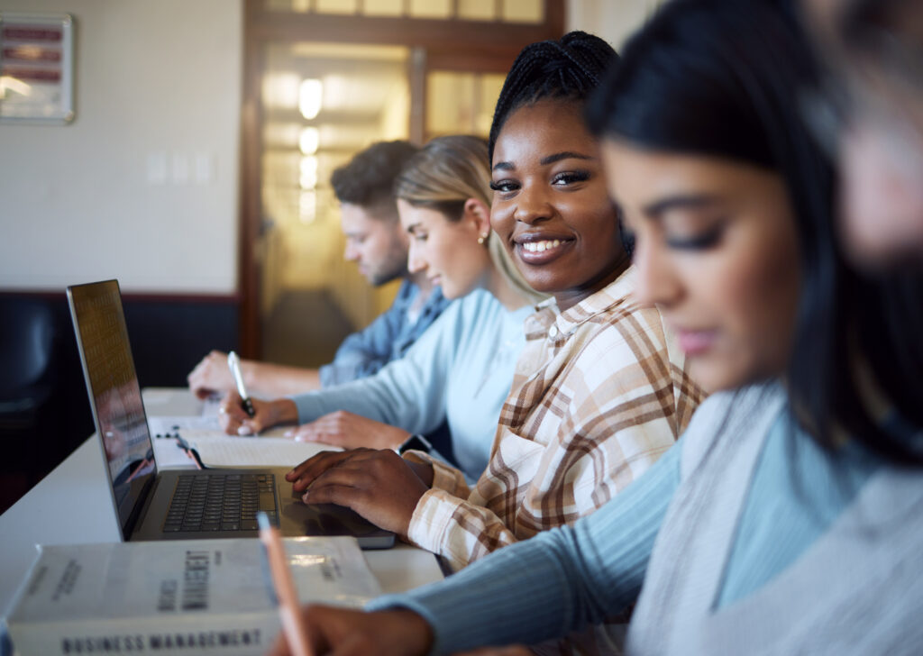 Student smiling with laptop for education