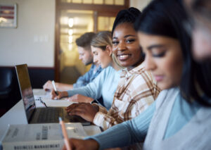 Student smiling with laptop for education