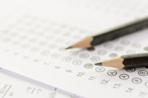 Pencil on answer sheets or Standardized test form with answers bubbled. Multiple choice answer sheet