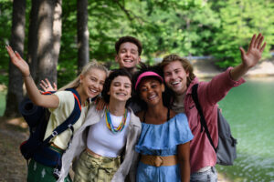 Portrait students camping trip near lake