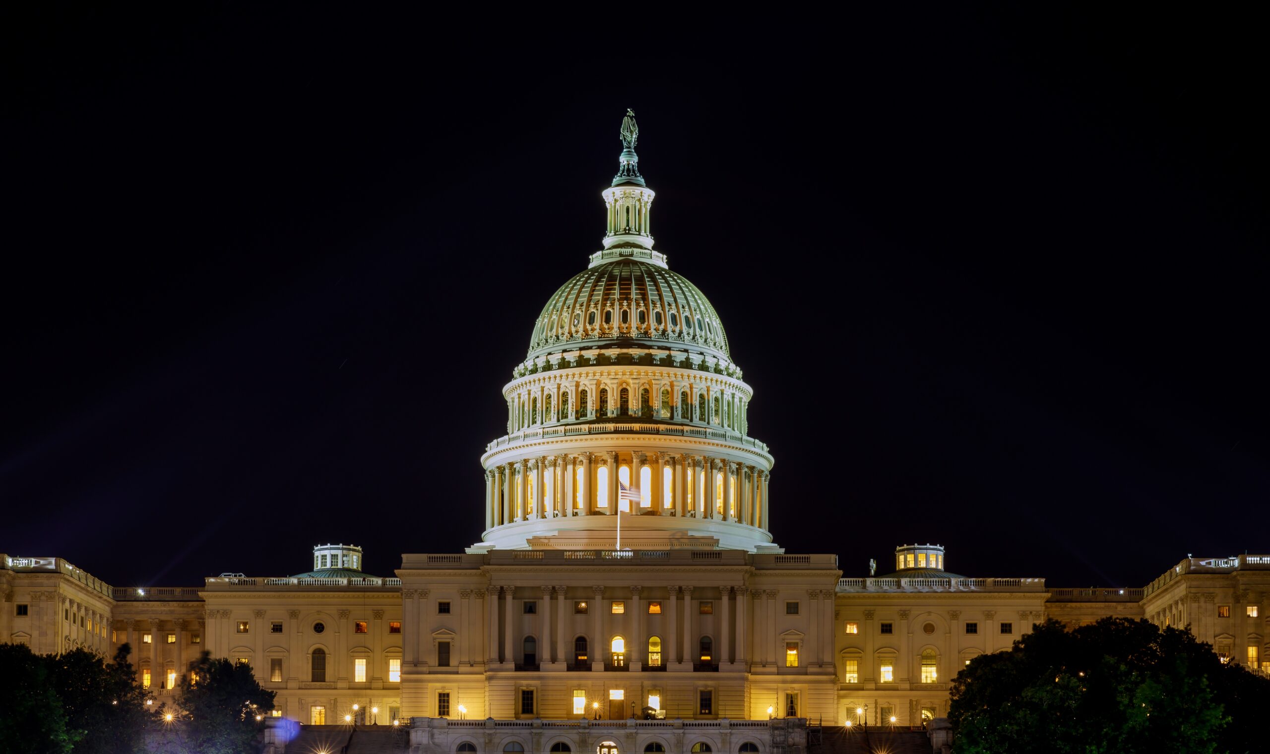 Capitol the United States building with the dome lit up at night the Senate House sides of the building