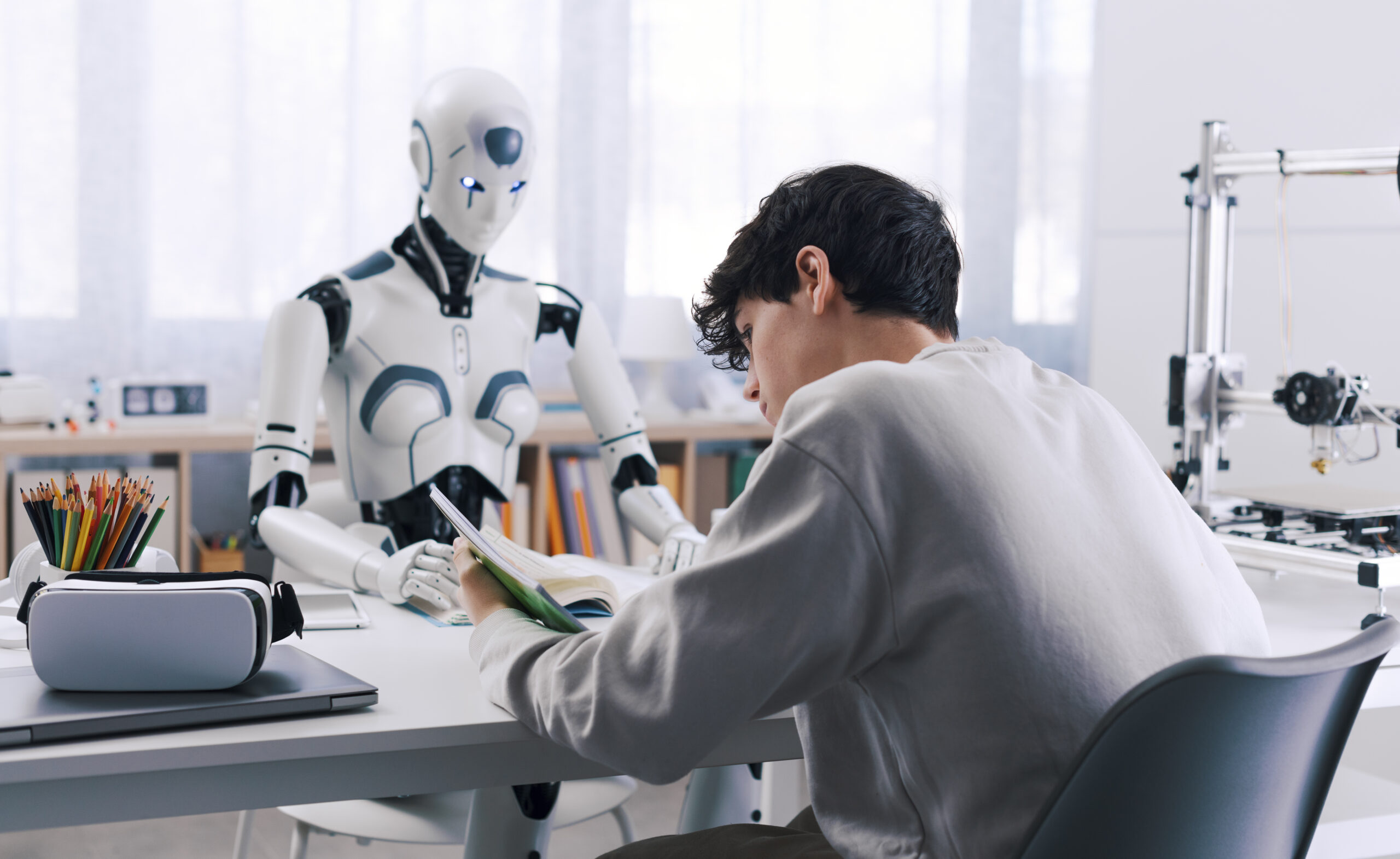 A student studies with the help of a robot.
